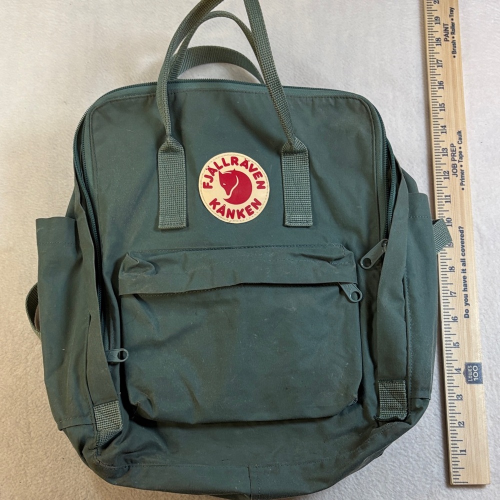 Fjallraven Kånken Backpack in Deep Green with Red Logo